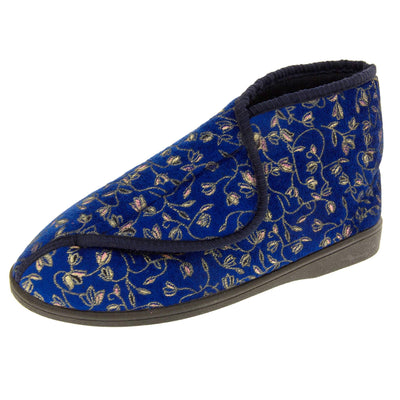 Ankle slippers. Womens bootie style slipper with a navy blue textile upper with vine and flower embroidered design and black edging. Touch fasten tab to the top and blue textile lining. Firm black sole. Left foot at an angle.