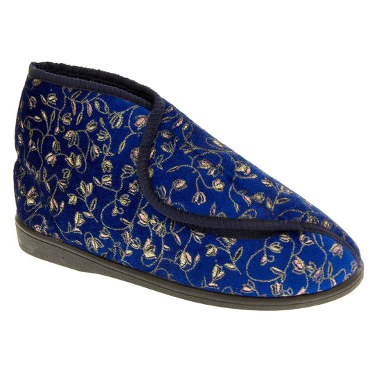 Ankle slippers. Womens bootie style slipper with a navy blue textile upper with vine and flower embroidered design and black edging. Touch fasten tab to the top and blue textile lining. Firm black sole. Right foot at an angle.