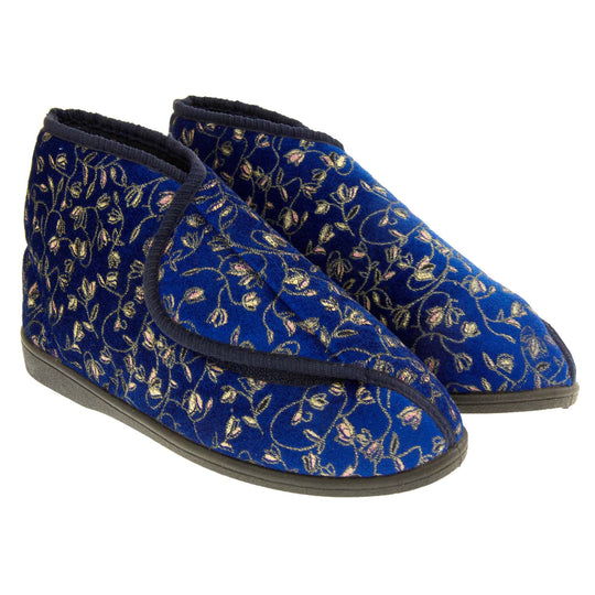Ankle slippers. Womens bootie style slipper with a navy blue textile upper with vine and flower embroidered design and black edging. Touch fasten tab to the top and blue textile lining. Firm black sole. Both feet together at angle.