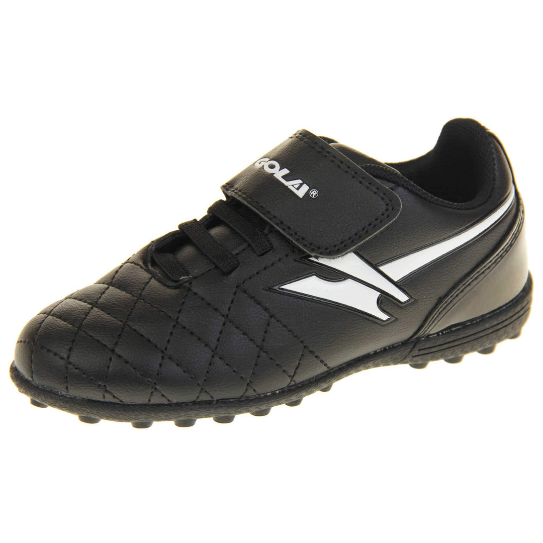 Astro turf boots. Black football trainers with stitching detail to the toes to give a quilted appearance. The touch close fastening and elasticated lace detail to the front. White Gola logo to the side and white Gola branding to the touch fasten strap. Black sole with small Astro turf studs to the base. Left foot at an angle.