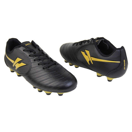 Kids football boots. Black football boots with line detailing to the toes. Lace-up fastening to the front. Gold Gola logo to the side and gold Gola branding to the tongue. Black sole with gold accents and studs to the base. Both feet facing top to tale from an angle.