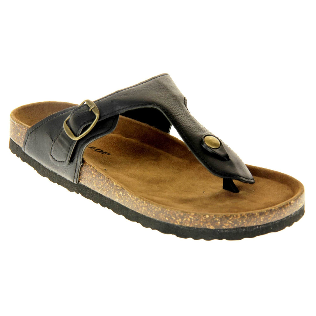Black buckle sandals. Black faux leather strap with toe post to the front and gold buckle to the outside. Soft tan faux suede footbed with cork effect outsole and black sole. Right foot at an angle.