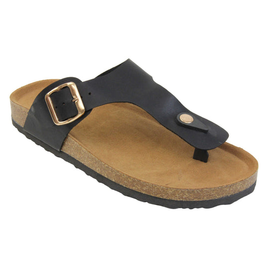 Black faux leather sandals. Black faux leather strap with toe post to the front and gold buckle to the outside. Soft tan faux suede footbed with cork effect outsole and black sole. Right foot at an angle.