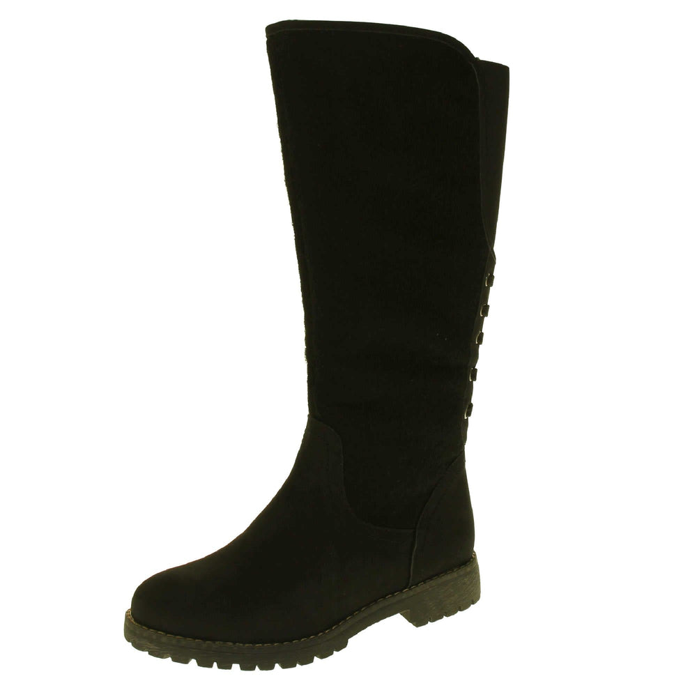 Black knee high boots with zip. Tall boots with a black faux nubuck leather and felt upper with an elastic panel and decorative laces to the back. Stitching detailing around the outsole and the ankle. Full length zip to the inside leg. Left foot at an angle.