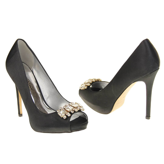 Black peep toe shoes. Classic women's peep toe high heels with a black satin upper. Metallic silver insole with Sabatine branding. Black satin stiletto heel with a cream sole. Diamante cluster detailing across the toes. Both feet at an angle facing top to tail.