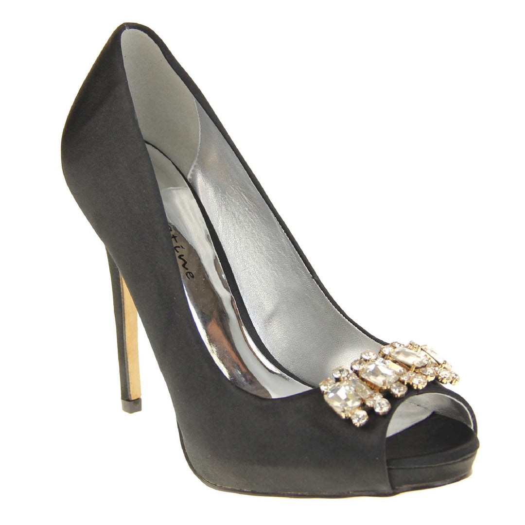Black peep toe shoes. Classic women's peep toe high heels with a black satin upper. Metallic silver insole with Sabatine branding. Black satin stiletto heel with a cream sole. Diamante cluster detailing across the toes. Right foot at an angle.