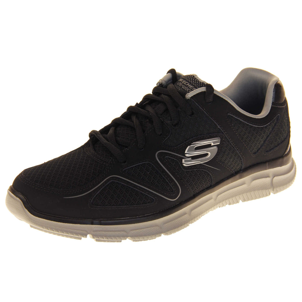 Black Skechers mens. Black mesh and leather upper with a thin wiggly grey line along the side from the toes. Black laces and grey textile lining. Grey and white Skechers logo to the side and chunky white outsole with grip. Left foot at an angle.