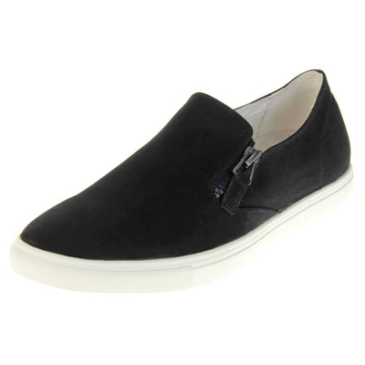 Black slip on pumps. Women's shoes with a black faux leather upper and zip detailing down the side of the tongue. White real leather lining. Thick white sole. Left foot at an angle.