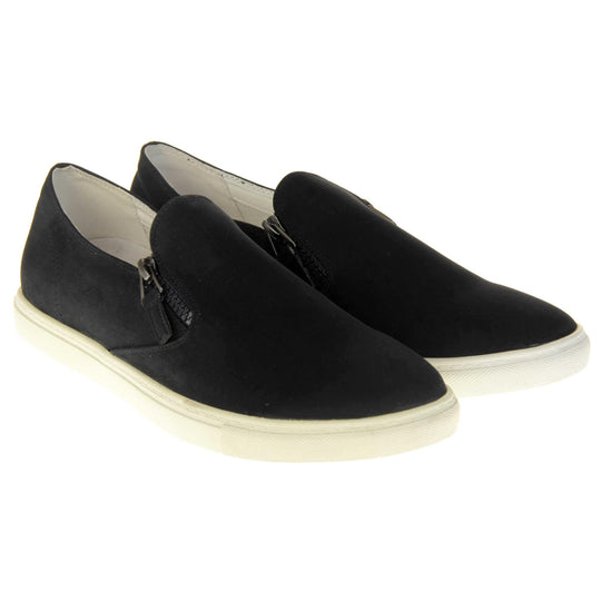 Black slip on pumps. Women's shoes with a black faux leather upper and zip detailing down the side of the tongue. White real leather lining. Thick white sole. Both feet together at a slight angle.