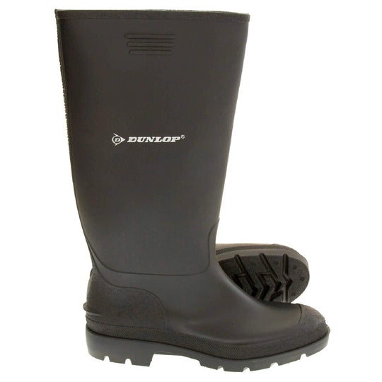 Black wellies. Black knee high wellies with a waterproof rubber upper and sole. With white Dunlop logo and brand on the side.  Both feet from side profile with the left foot on its side to show the sole.