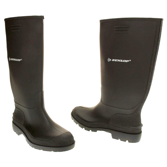 Black wellies. Black knee high wellies with a waterproof rubber upper and sole. With white Dunlop logo and brand on the side. Both feet facing top to tail at a slight angle.