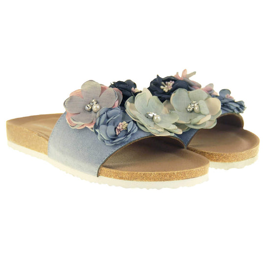 Blue Flower Sandals - Stunning festival style flowers across the top strap decorated with pearls and diamantes. Soft tan faux leather footbed sandals with white soles. Perfect for weddings, beaches, holidays or casual wear. Both feet view.