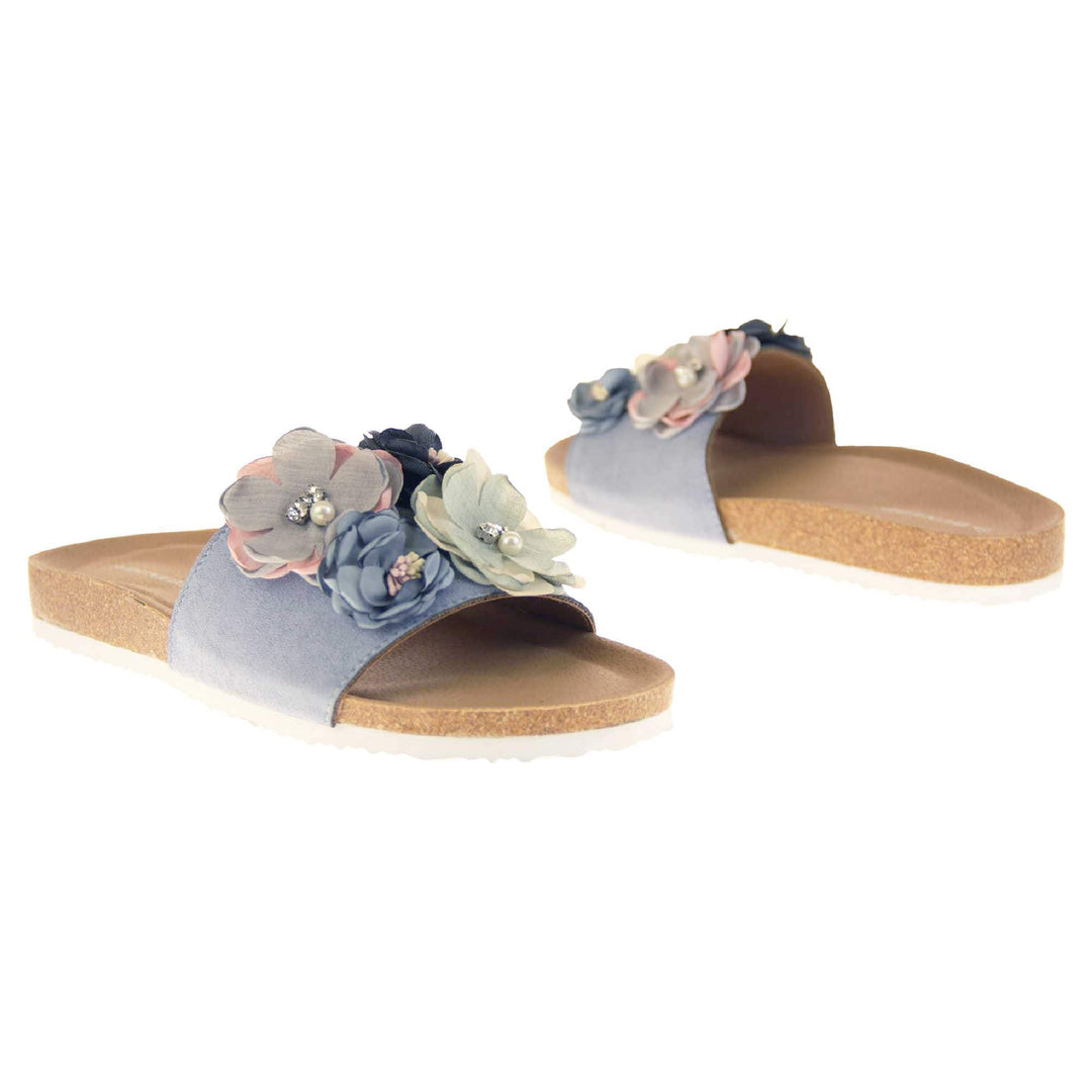 Blue Flower Sandals - Stunning festival style flowers across the top strap decorated with pearls and diamantes. Soft tan faux leather footbed sandals with white soles. Perfect for weddings, beaches, holidays or casual wear. Both feet facing opposite directions.