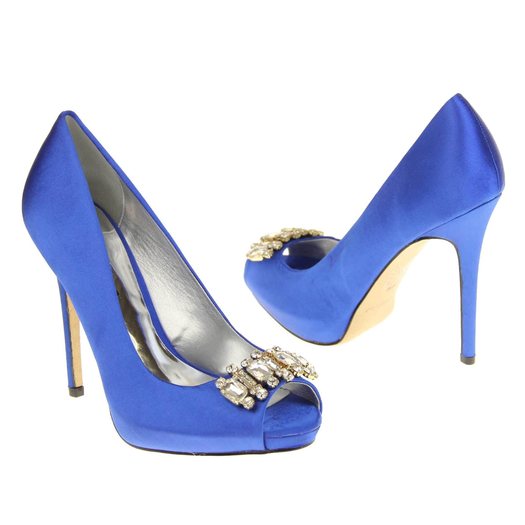 Blue peep toe shoes. Classic women's peep toe high heels with a blue satin upper. Metallic silver insole with Sabatine branding. Blue satin stiletto heel with a cream sole. Diamante cluster detailing across the toes. Both feet at an angle facing top to tail.