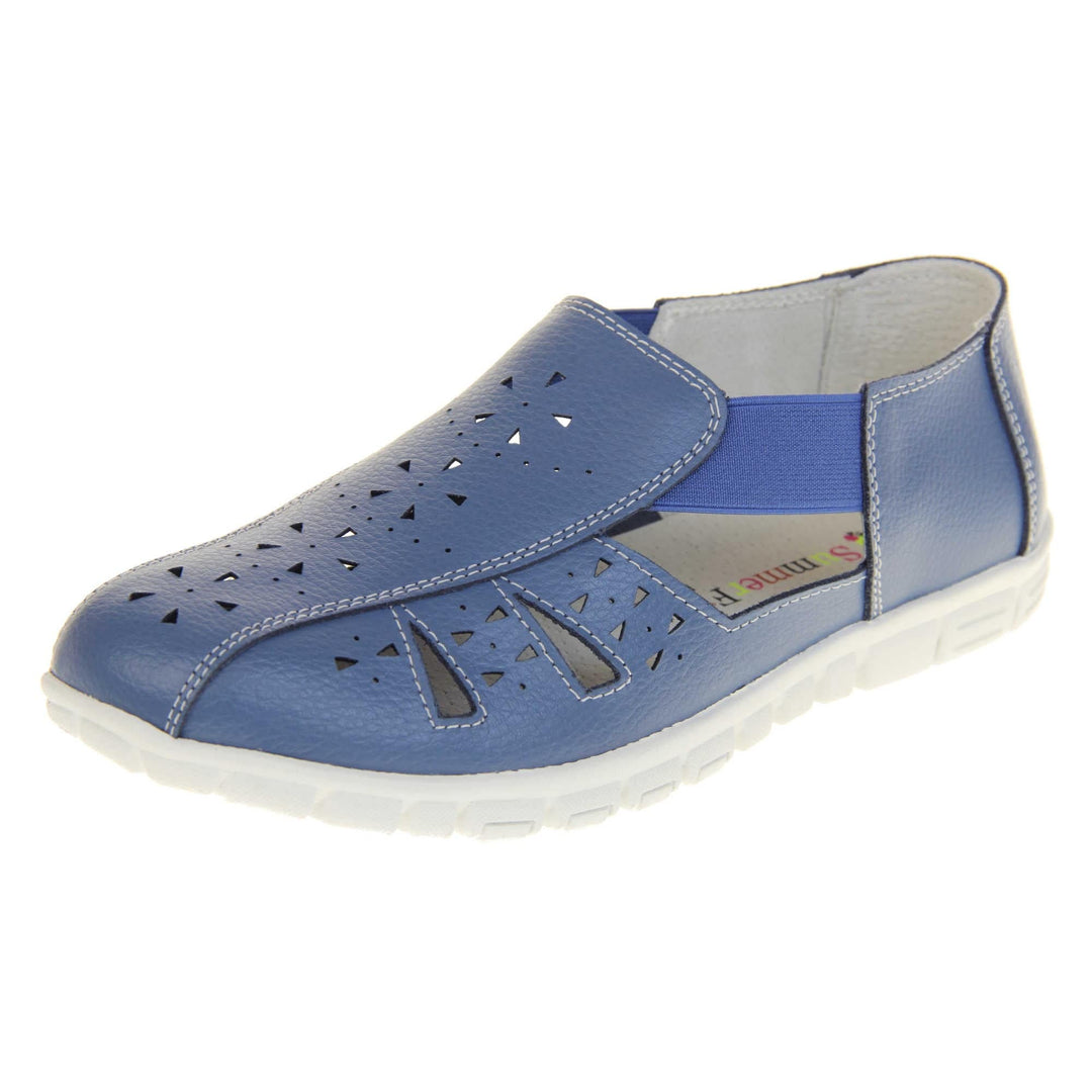 Blue wide fit sandals. Womens classic full foot sandal with a blue leather upper. Strappy sides with cut out designs along the side and centre straps. Blue elasticated straps joining the centre to the backs. White insole and leather lining. White sole with grip to the bottom. Left foot at an angle.