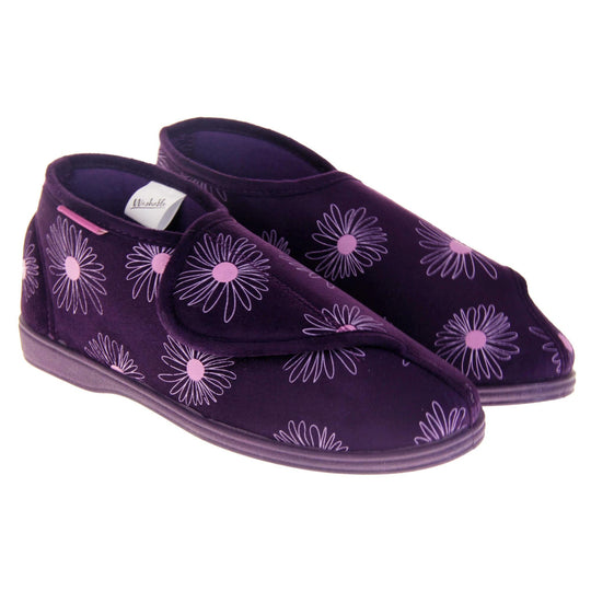Bootie slippers. Womens bootie style slipper with a purple textile upper with a pink flower print. Touch fasten tab to the top and purple textile lining. Firm purple sole. Both feet together at angle.