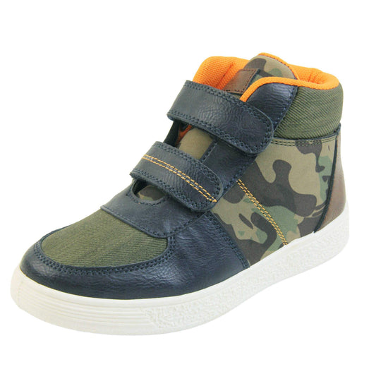 Boots for Boys. Boys canvas ankle boots with camouflage sides and tongue, khaki collar and upper toes and navy faux leather edging details. Touch fasten straps to the front with a white sole. Left foot at an angle