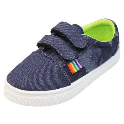 Boys camo shoes. Kids trainers with a grey and black camouflage print denim effect upper. Plain toes and straps. Two touch fasten straps over the top of the shoe. Small rainbow tag to the outside by the straps. Lime green textile lining and white chunky sole. Left foot at an angle.