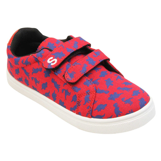 Boys dinosaur shoes. Kids trainers with a red canvas upper with blue dinosaur print. Two touch fasten straps over the top of the shoe with the top strap having the Skyrocket S logo on the end. Black textile lining and white chunky sole. Right foot at an angle.