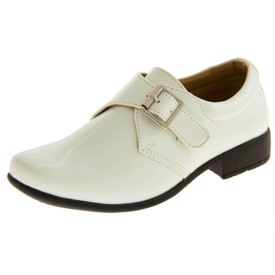 Boys Formal Shoes. White patent monk style shoes with a buckle effect touch close fastening and a black sole. Left foot at an angle