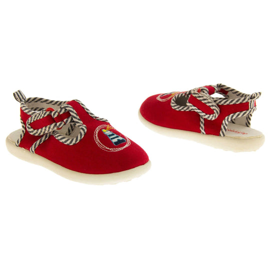 Boys sandals. Red canvas sandals with cut out heel. White sole with lighthouse detail on the front of the shoes and blue and white striped edging.  Both shoes facing top to tail next to each other.