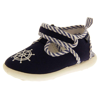 Boys sandals. Navy canvas t-bar pumps with white sole, anchor detail to the front and blue and white edging. Left foot at angle