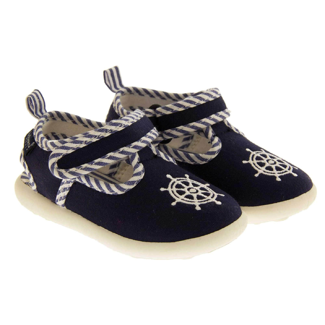 Boys sandals. Navy canvas t-bar pumps with white sole, anchor detail to the front and blue and white edging.  Both feet together