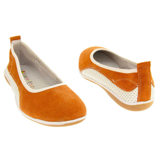 Burnt orange shoes. Ballet style flat with an orange suede upper. White leather mesh runs along the bottom of the back half of the shoe. Brown sole. White edging around the sole and the opening of the shoe. White leather lining. Orange suede leather loop on heel of the shoe to help pull on. Both feet at an angle facing top to tail.