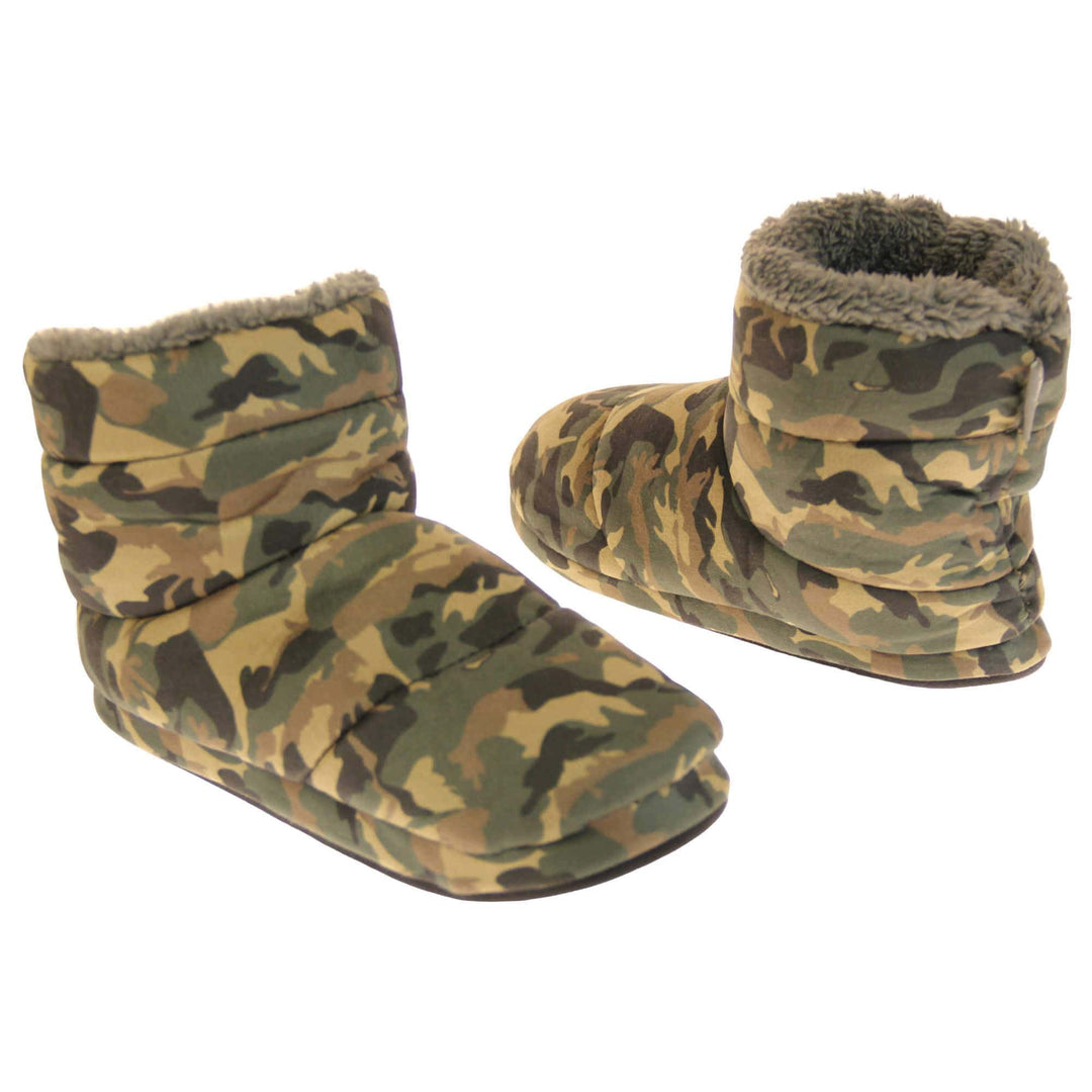 Camo slippers mens. Slipper boots with a camouflage army print textile upper. In khaki, brown, black and sand colours. With a firm black synthetic sole with grip to the base. Grey faux fur lining. Both feet at a slight angle, facing top to tail.