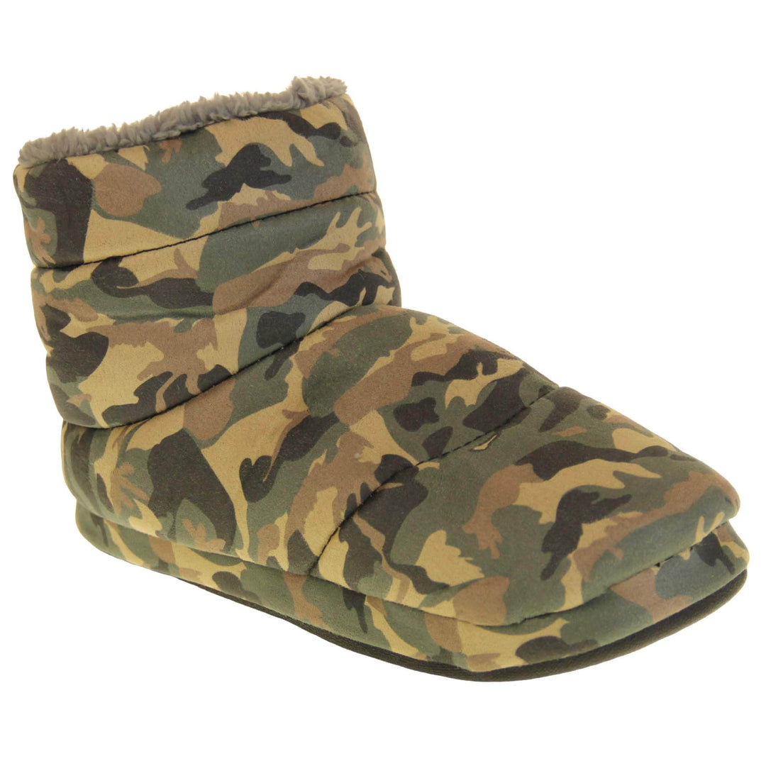 Camo slippers mens. Slipper boots with a camouflage army print textile upper. In khaki, brown, black and sand colours. With a firm black synthetic sole with grip to the base. Grey faux fur lining. Right foot at an angle.