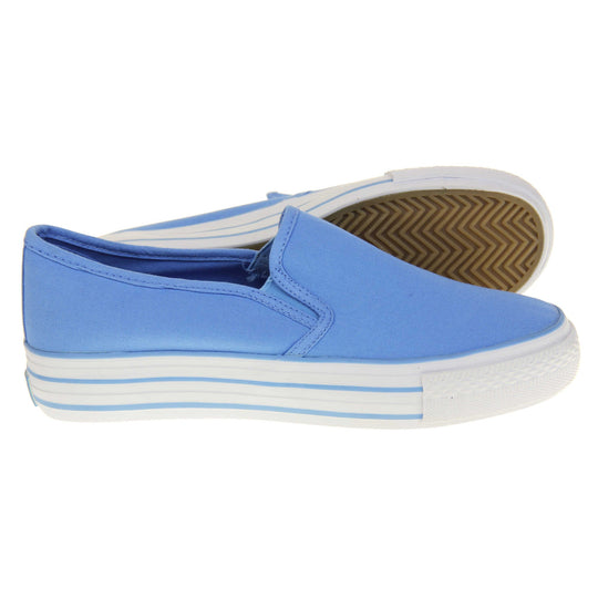 Canvas pumps. Slip on plimsoll style shoes with a blue canvas upper. Blue elasticated gusset. White flat platform sole with two blue lines running around the middle. Both feet from a side profile with the left foot on its side behind the the right foot to show the sole.