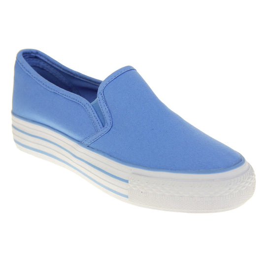 Canvas pumps. Slip on plimsoll style shoes with a blue canvas upper. Blue elasticated gusset. White flat platform sole with two blue lines running around the middle. Right foot at an angle.