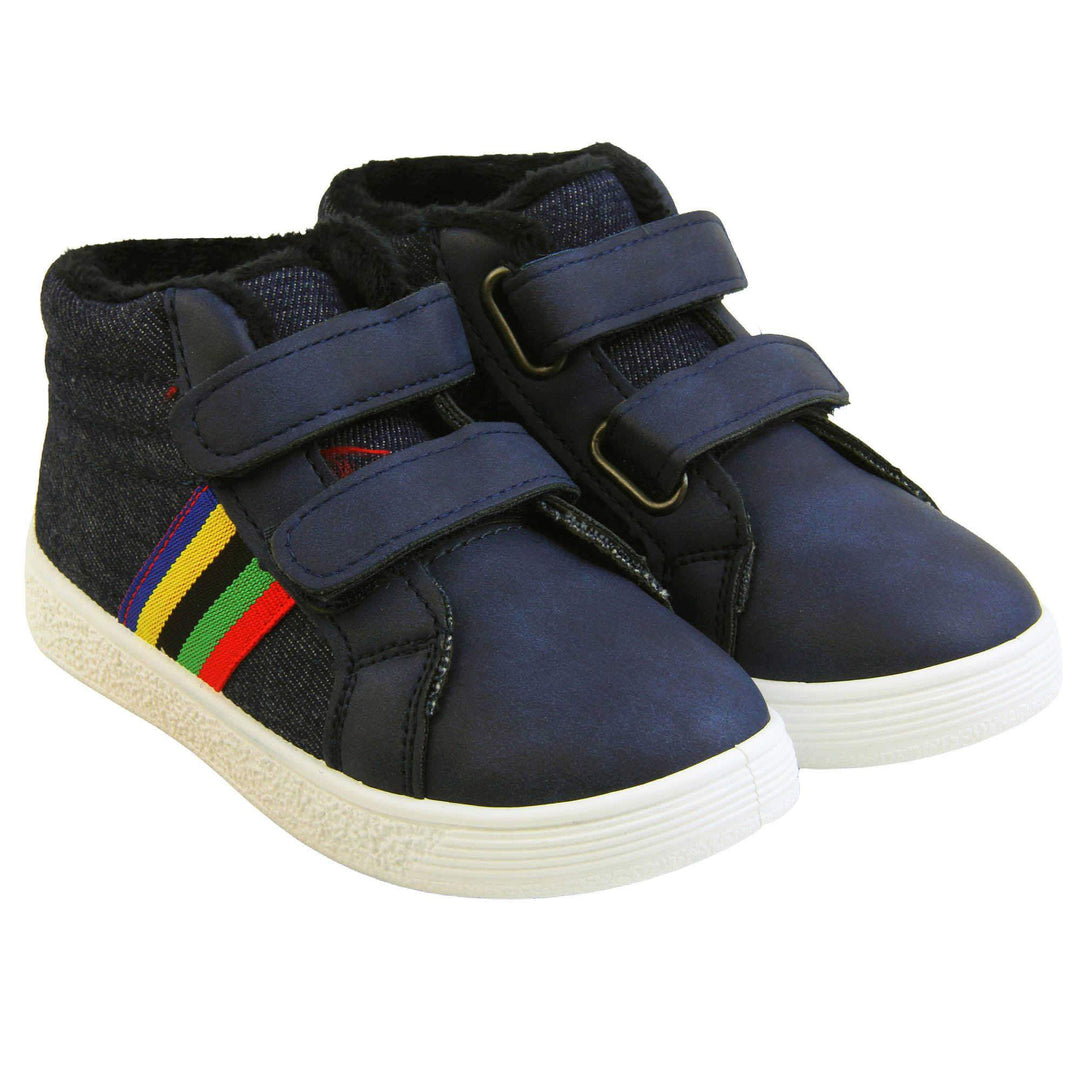 Kids Denim Blue Hi-top Trainer Boots - Denim blue and smooth faux leather upper with dual hook and loop fastening, white outsole, rainbow stripe to side, green dinosaur spine to heel and dark blue fleece lining. Both feet together at angle.
