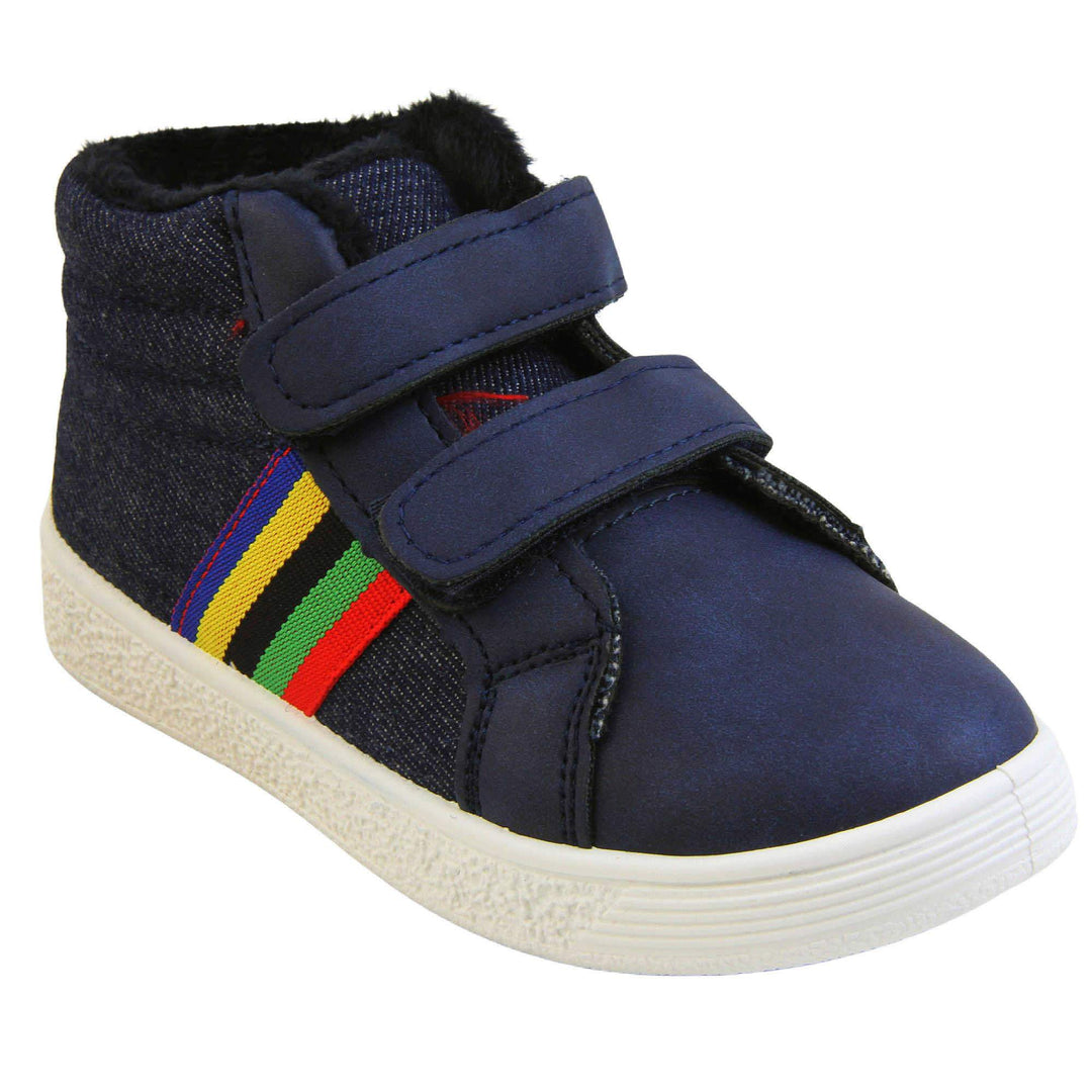 Kids Denim Blue Hi-top Trainer Boots - Denim blue and smooth faux leather upper with dual hook and loop fastening, white outsole, rainbow stripe to side, green dinosaur spine to heel and dark blue fleece lining. Right foot at angle.