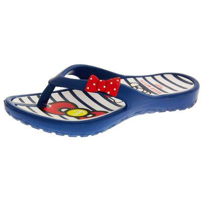 Children's flip flop. Hello Kitty flip flop with navy blue sole and straps in a toe-post design with small red bow with white spots on. White and navy striped insole with Hello Kitty design on. Left foot at a slight angle.
