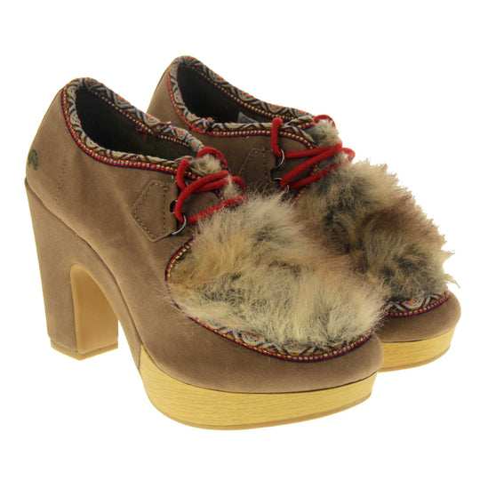 Chunky block heels. Womens bootie style shoe with a brown faux suede upper. Embroidered pattern around the collar and seams. Brown faux fur patch to the front and red laces. Rocket Dog logo to the heel of the bootie. Wood style platform to the front of the shoe with a chunky block heel in brown faux suede to the back. Nude sole. Both feet together at a slight angle.