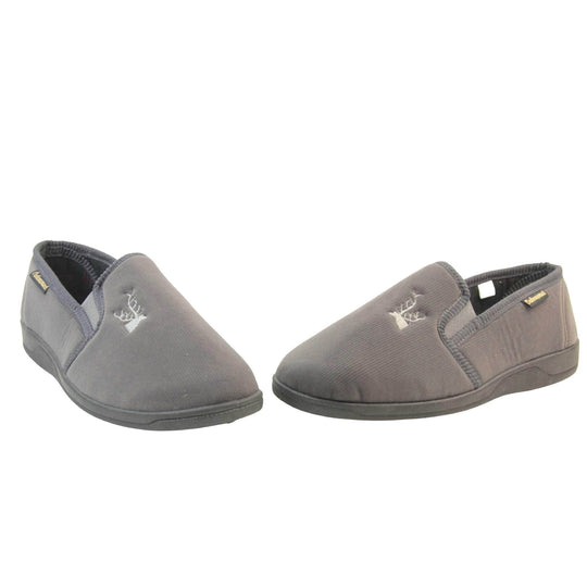 Classic Slippers. Mens full back slippers with a grey velour uppers. Grey elasticated panels joining the tongue to the top of the slippers. Grey stag head detail embroidered onto the top of the upper, near the tongue. Small black label on the outside rim, with Oakenwood branding sewn in gold. Plaid textile lining. Both feet in a wide V shape with toes almost touching.