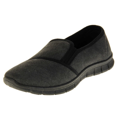 Comfortable black work shoes. Slip on plimsoll style shoes with a black canvas upper. Black elasticated gusset. Chunky black sole. Left foot at an angle.