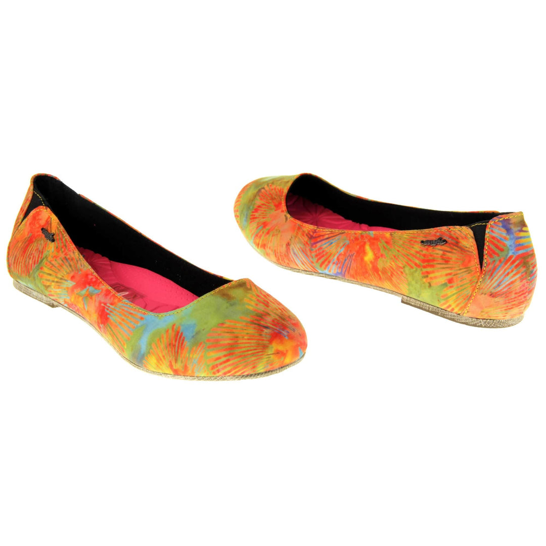 Comfy ballet flats. Women's ballerina shoes with a textile upper in a bright tie dye style. Black textile lining with neon pink cushioned insole. Both feet at an angle facing top to tail.
