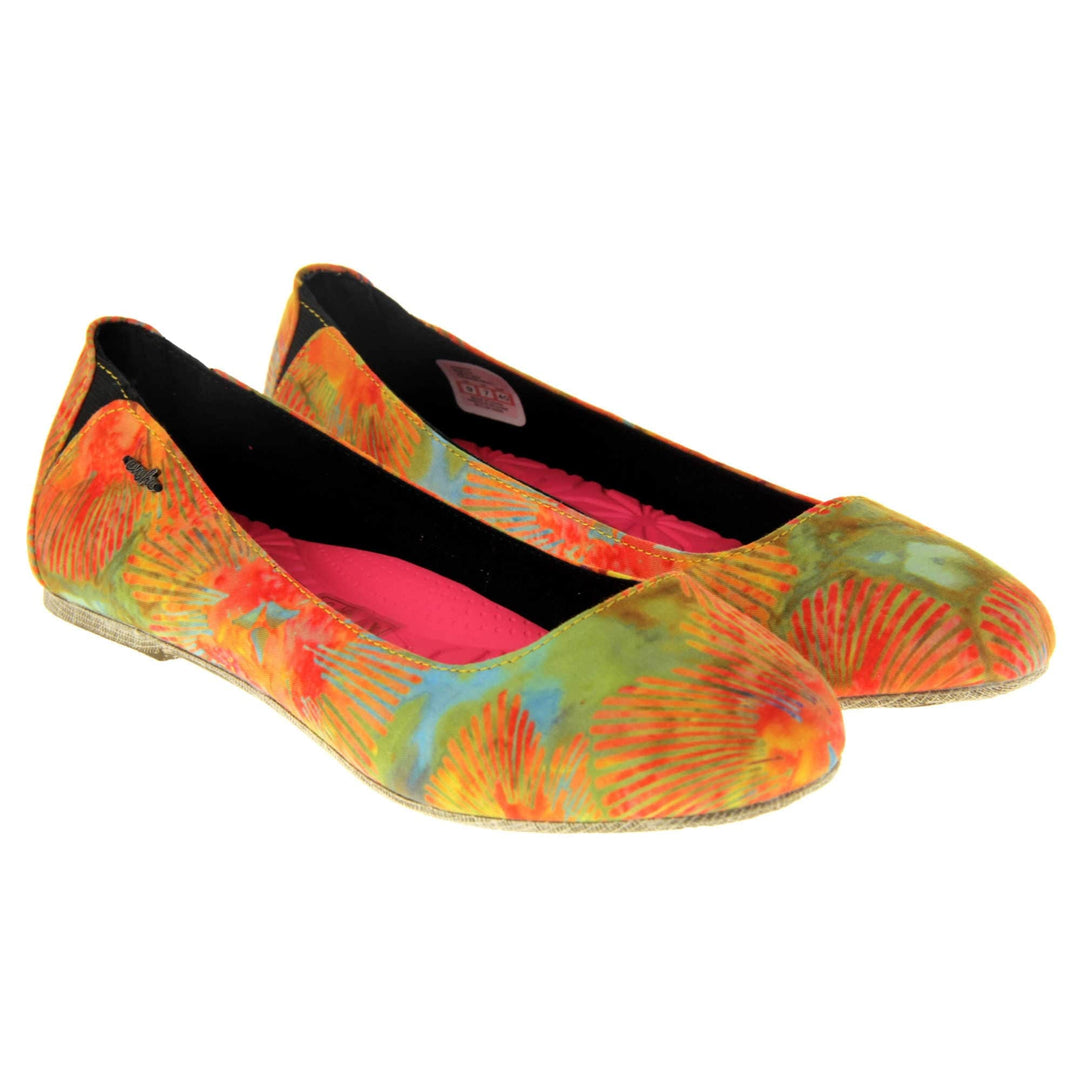 Comfy ballet flats. Women's ballerina shoes with a textile upper in a bright tie dye style. Black textile lining with neon pink cushioned insole. Both feet together at a slight angle.
