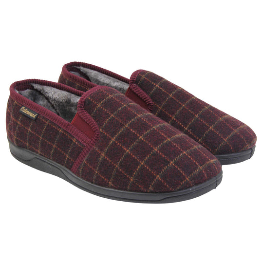 Comfy mens slippers. Full back slippers with burgundy wool effect upper with orange check. Red elasticated panels joining the tongue to the top of the slippers. Small black label on the outside rim, with Oakenwood branding sewn in gold. Grey faux fur lining. Both feet together at an angle.
