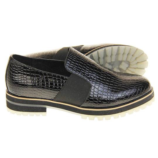 Croc loafers womens. Loafer style shoes with a black faux snakeskin upper. With twin black elasticated side panels. Chunky black and cream sole with slip resistant grip to the bottom. Both feet from a side profile with the left foot on its side behind the the right foot to show the sole.