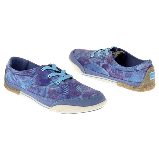 Tie dye trainers. Sneaker style shoes with a dark blue canvas upper with a tie dye pattern in light blue and purple. Light blue laces. Cushe Hoffman label on the tongue. White and blue outsole with the heel being espadrille style. Both feet at an angle facing top to tail.