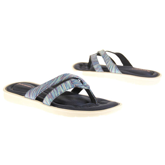 Dunlop flip flops. Womens flip flops with two straps done in a purple, teal and blue textile material meeting at a toe post. Black moulded, cushioned insole with white sole.  Both feet at an angle facing top to tail.