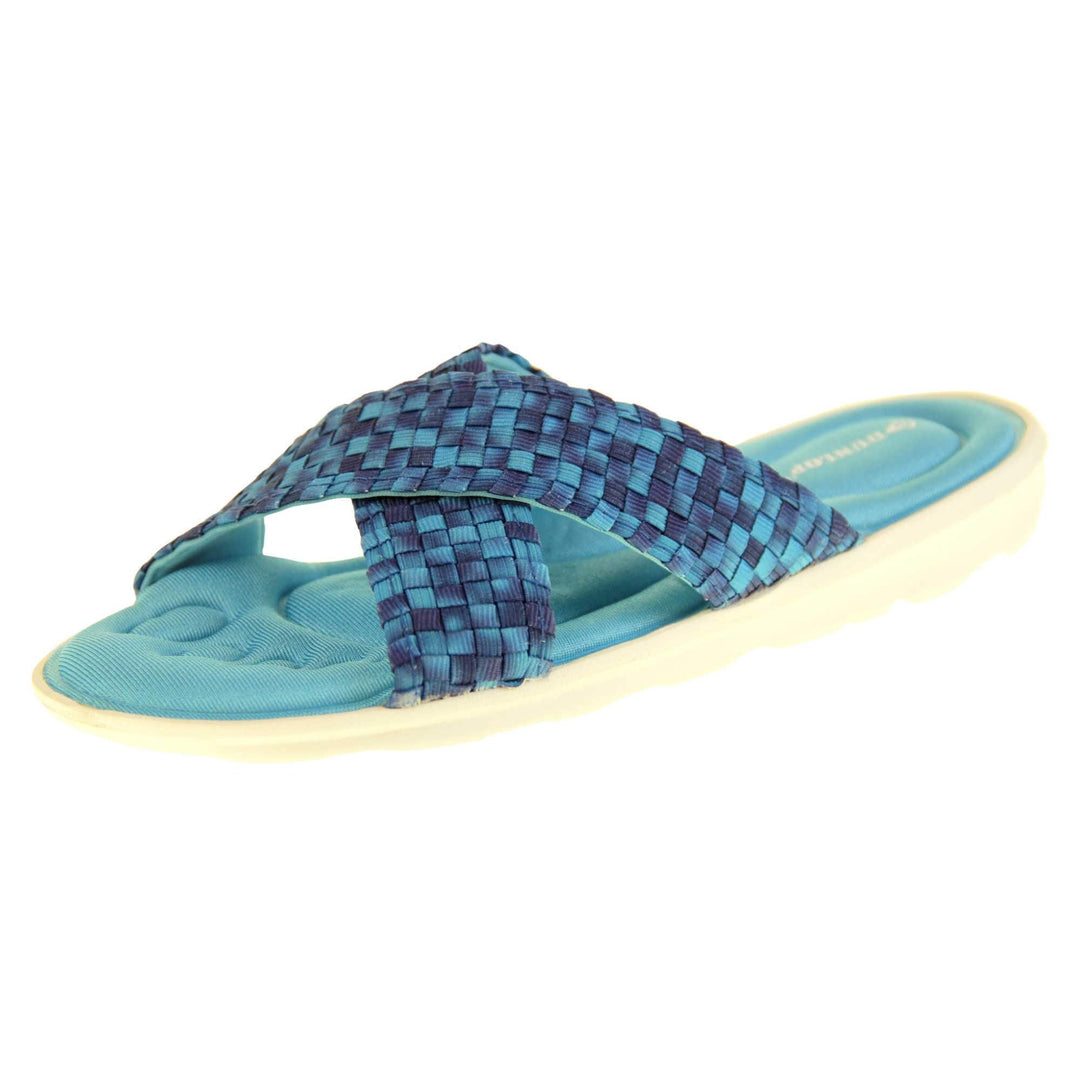 Womens slide sandals - Royal blue mosaic style straps in crossover design with dense memory foam insoles - perfect comfy sandals for women. Quick and easy slip on flip flops with light blue insole and white outsole with a slight wedge heel. Left foot at an angle.