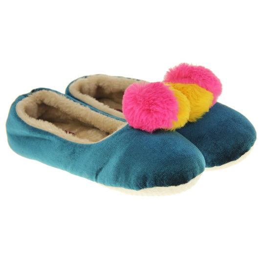Womens ballet slippers. Ladies slippers in a ballerina style. Teal velvety upper with fluffy yellow and pink pom pom on the top. Cream faux fur lining. Beige textile sole with bumps to the bottom for grip. Both feet together at an angle.