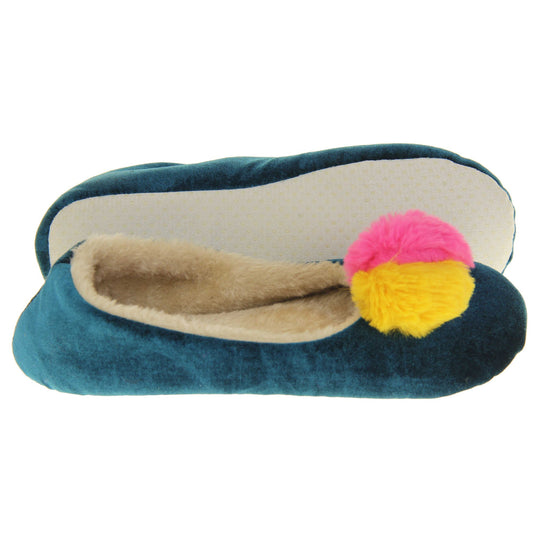 Womens ballet slippers. Ladies slippers in a ballerina style. Teal velvety upper with fluffy yellow and pink pom pom on the top. Cream faux fur lining. Beige textile sole with bumps to the bottom for grip.  Both feet from a side profile with the left foot on its side to show the sole.