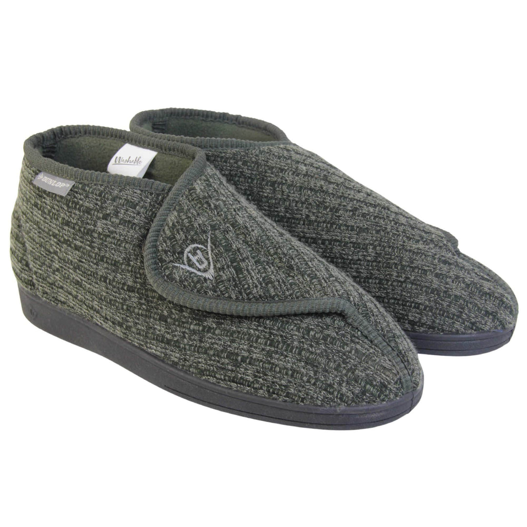 Orthopaedic slippers for men. Mens orthopaedic slippers in an ankle boot style. With a khaki knit upper and green fleece lining. With an adjustable touch close top with a grey Dunlop logo on. Small grey label to the outer side edge with Dunlop written on. Thick black outdoor sole. Both feet together at an angle.