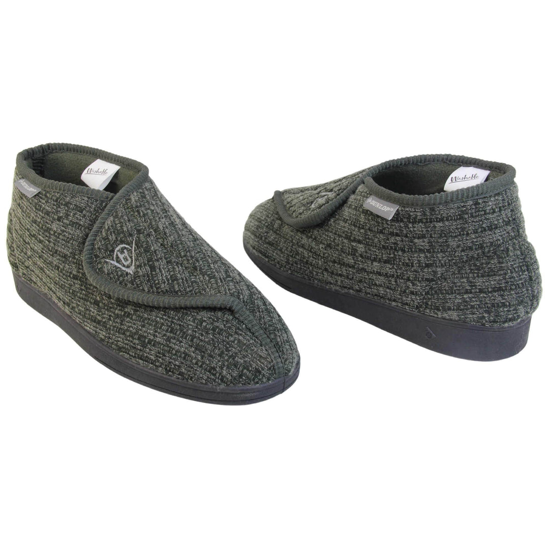 Orthopaedic slippers for men. Mens orthopaedic slippers in an ankle boot style. With a khaki knit upper and green fleece lining. With an adjustable touch close top with a grey Dunlop logo on. Small grey label to the outer side edge with Dunlop written on. Thick black outdoor sole. Both feet at an angle facing top to tail.