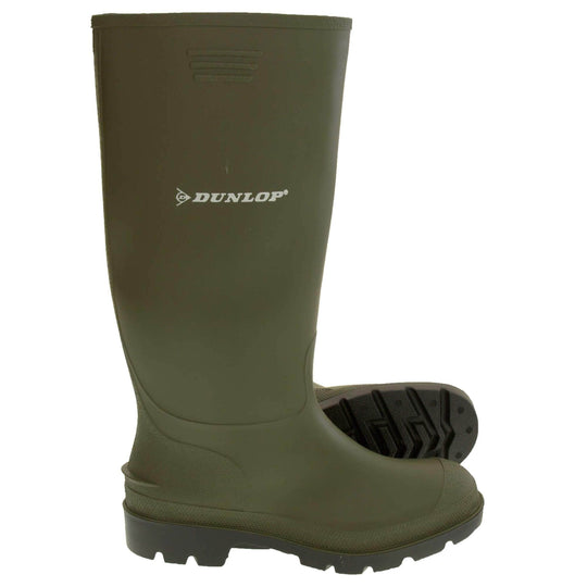 Dunlop wellington boots. Green knee high wellies with a waterproof rubber upper and sole. With white Dunlop logo and brand on the side.  Both feet from side profile with the left foot on its side to show the sole.